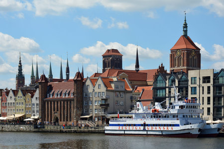 Cityscape of Gdansk at the river Motlawa with the tower of the Church Saint Mary and Church Saint...