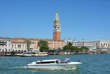 View over the Grand Canal on San Marco with the clock tower Campanile of Venice - Italy.の写真素材