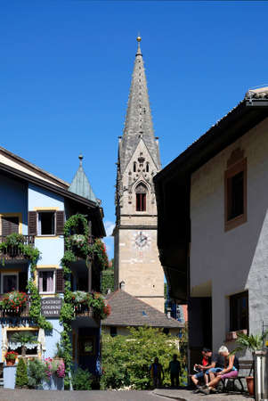 View of the town center of Tramin at the South Tyrolean wine route at Bolzano with the Parish church - Italy.のeditorial素材