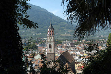 View of Merano in South Tyrol with the parish church of St. Nicholas from the 14th and 15th centuries - Italy.のeditorial素材
