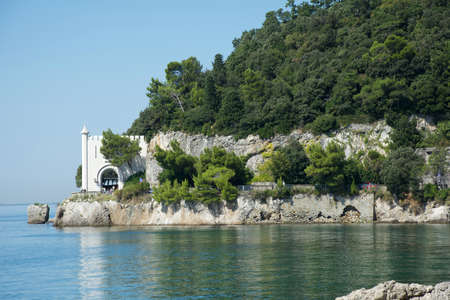 Entrance to Miramare Castle on a rocky cliff in the Bay of Grignano near Trieste - Italy.のeditorial素材