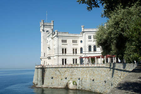 Miramare Castle on a rocky cliff in the Bay of Grignano near Trieste - Italy.のeditorial素材