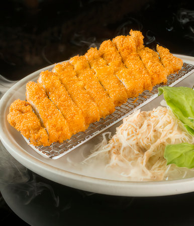 japanese cuisine. fried fish on the background of the smokeの写真素材