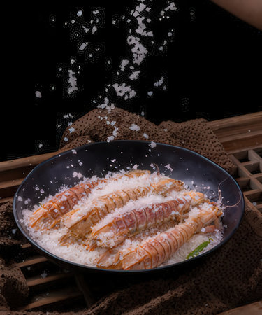 Shrimp on rice on black background.の写真素材