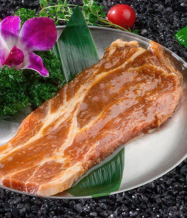 Raw fresh salmon steak on black stone background, top view, selective focusの写真素材