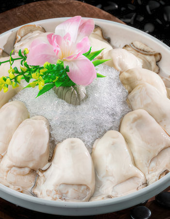 Sweetmeat in a white bowl on wooden table.の写真素材