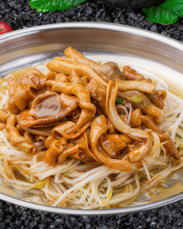 Stir-fried mushrooms on black sesameの写真素材