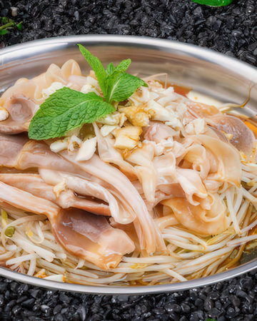 Rice noodles with chicken and vegetables in a bowl, closeupの写真素材