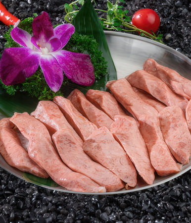 Slices of raw pork meat on a plate, close upの写真素材