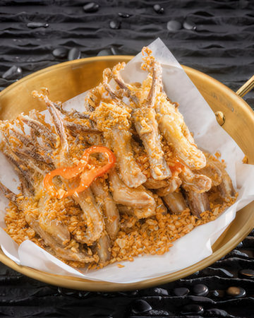 fried chicken wings on a background of riceの写真素材