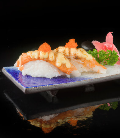 japanese cuisine. sushi on the background of a black backgroundの写真素材