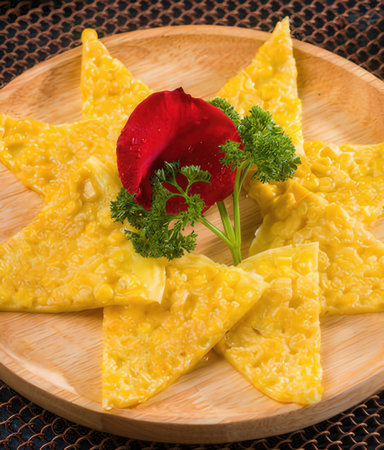 Ravioli with cheese and dill on a wooden plateの写真素材