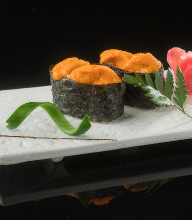 Japanese cuisine. Sushi on a black background. Toned.の写真素材