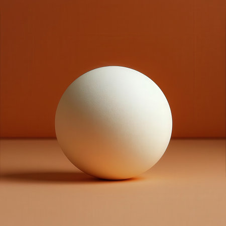 3d render of a white ball on an orange background with shadowsの素材