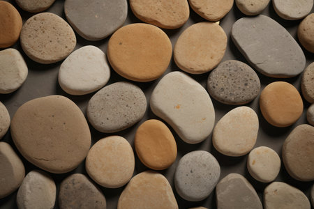 pebble stones on a gray background, closeup of photoの写真素材
