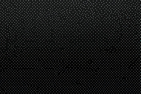 Abstract background. Black and white dots on a black background. Texture.の写真素材