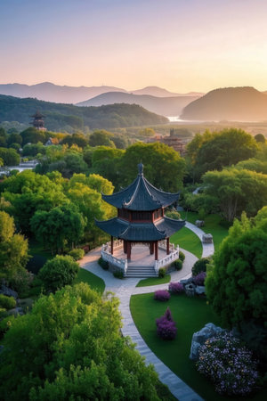 Aerial view of chinese pavilion in the park at sunsetの素材