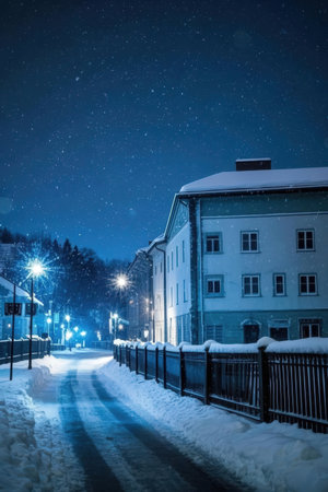 Night city street with houses and lanterns in winter, Czech Republicの素材