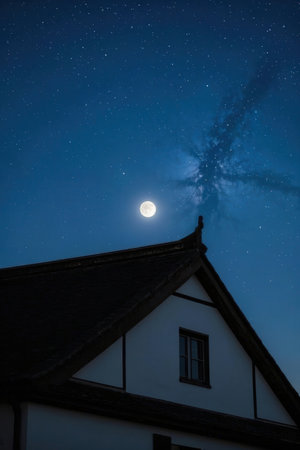 Full moon over the house in the village at night with stars.の素材