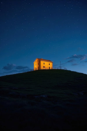 Night view of the old house on the hill with starry skyの素材