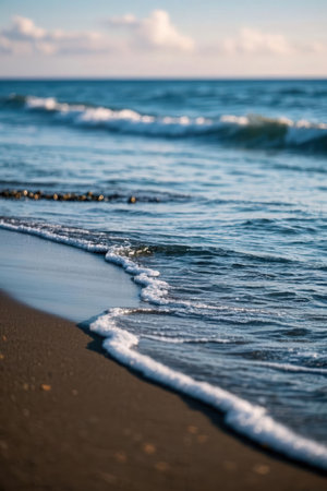 Beautiful seascape. Sea waves on the sandy beach.の素材