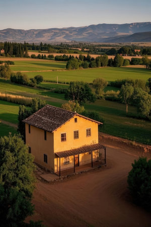 Old house in the countryside with mountains in the background, Tuscany, Italyの素材