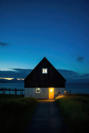Wooden house on the beach with starry sky at night.の素材