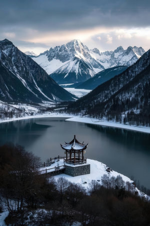 Beautiful winter landscape with a pavilion on the lake in the mountainsの素材