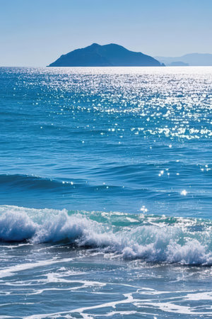 Seascape with blue sea and mountains on the horizon in Greeceの素材
