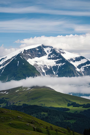 Mountain landscape with cloudy sky and green grass. Caucasus, Russiaの素材