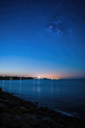 Night sky with stars and milky way over the sea. Long exposure.の素材
