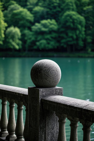 stone balustrade on the background of the lake in the parkの素材