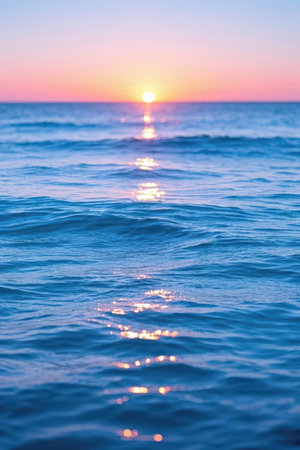 Sunset on the sea. The sun is reflected in the water.の素材