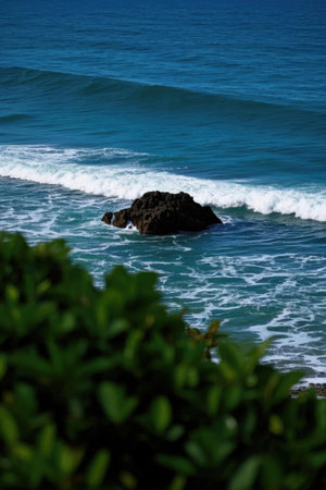 Beautiful seascape with waves breaking on the shore and stonesの素材