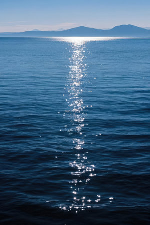 Sunset over the sea with sun rays reflected in the water.の素材