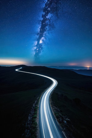 Long exposure of a car light trail in the mountains at night.の素材