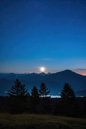 Mountain night landscape with starry sky and moon in the backgroundの素材