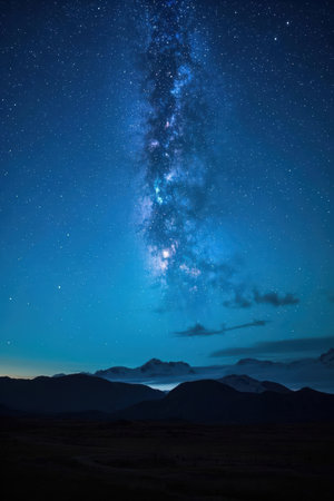 Milky Way over the mountains at night. Long exposure photograph.の素材