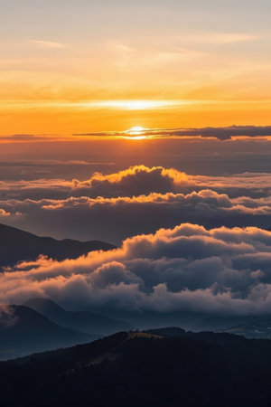 Sunrise over the clouds in the mountains. Landscape with a view of the mountains.の素材