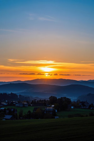 Sunset over the village in the Carpathians, Ukraine.の素材