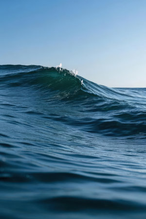 Blue wave in the sea. Close-up view of the surface.の素材
