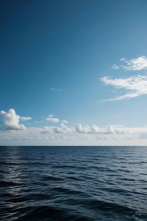 Blue sky with clouds and sea. Natural background. Copy space.の素材