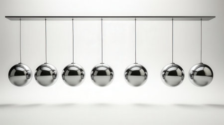 Newton's cradle on a white background. 3D rendering.の素材