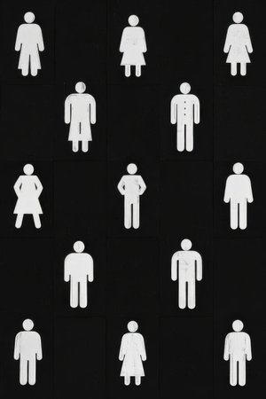 White men and women silhouettes on a black background. Top view.の素材