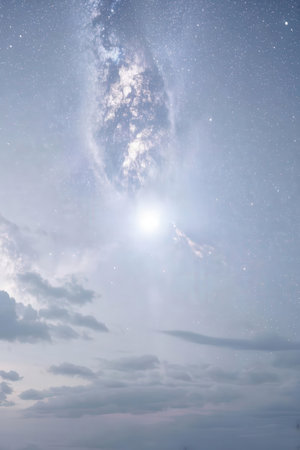 Night sky with stars and milky way. Clouds and the moonの素材