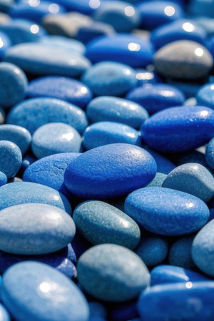 Colorful pebbles background. Blue and white pebbles.の素材