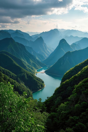 Mountain landscape with lake and cloudy sky in summer, China.の素材
