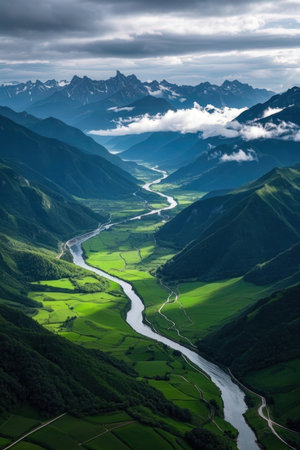 Beautiful mountain landscape with a river in the middle of the valleyの素材