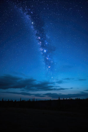 Milky Way in the Night sky. Long exposure photograph with grainの素材