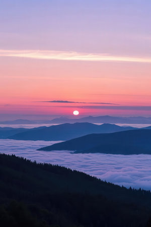 Foggy sunrise in the mountains. Landscape with colorful sky.の素材